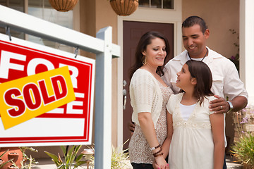 Image showing Hispanic Family in Front of Their New Home with Sold Sign