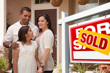Image showing Hispanic Family in Front of Their New Home with Sold Sign