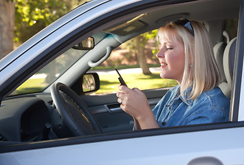 Image showing Woman Text Messaging While Driving