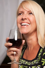 Image showing Beautiful Blonde Enjoying Wine