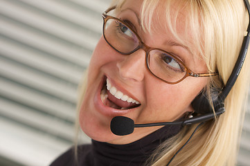 Image showing Attractive Businesswoman with Phone Headset