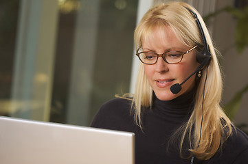 Image showing Attractive Businesswoman with Phone Headset