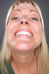 Image showing Smiling Blond Woman with Funny Face