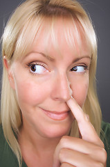 Image showing Blond Woman with Finger in Her Nose
