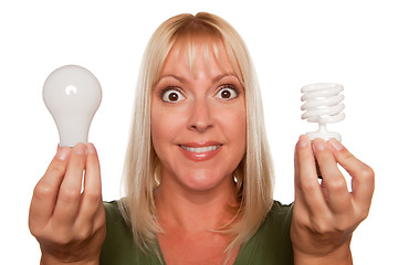 Image showing Woman Holds Energy Saving and Regular Light Bulbs