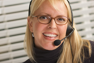 Image showing Attractive Businesswoman with Phone Headset