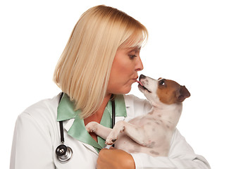 Image showing Attractive Female Doctor Veterinarian with Small Puppy