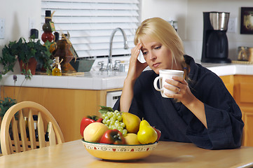 Image showing Woman Holding Head in Kitchen