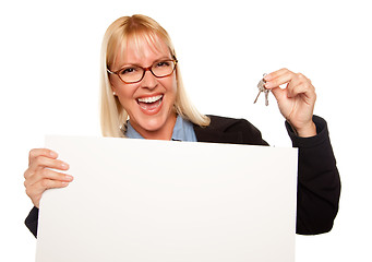 Image showing Attractive Blonde Holding Keys and Blank White Sign