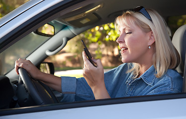 Image showing Woman Text Messaging While Driving