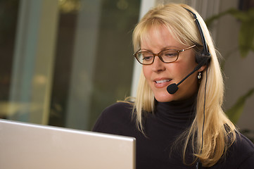 Image showing Attractive Businesswoman with Phone Headset