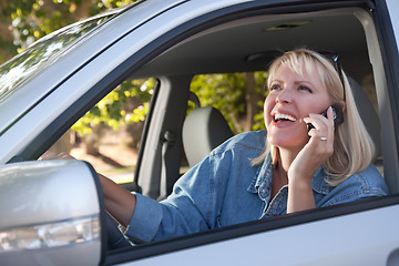 Image showing Attractive Woman Using Cell Phone While Driving