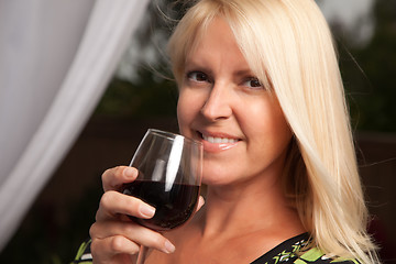 Image showing Beautiful Blonde Enjoying Wine