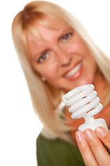 Image showing Attractive Blonde Woman Holds Energy Saving Light Bulb