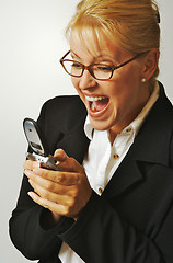 Image showing Businesswoman using her cell phone.