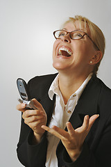 Image showing Businesswoman using her cell phone.