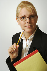 Image showing Beautiful Woman Thinks with Pencil & Notepad