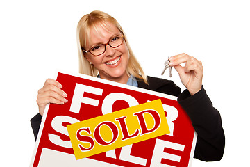 Image showing Attractive Blonde Holding Keys & Sold For Sale Sign