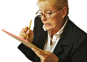 Image showing Female Erases Mistake on her Notepad