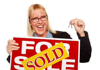 Image showing Attractive Blonde Holding Keys & Sold For Sale Sign