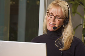 Image showing Attractive Businesswoman with Phone Headset