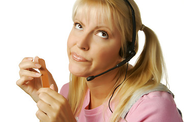 Image showing An obviously bored customer support girl.