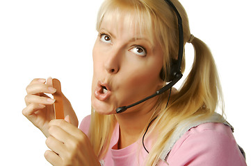 Image showing An obviously bored customer support girl.