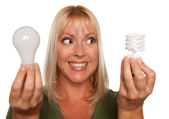 Image showing Woman Holds Energy Saving and Regular Light Bulbs