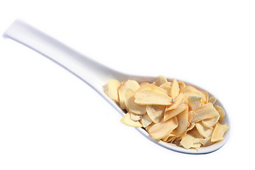 Image showing Garlic slices on a spoon