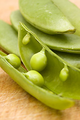 Image showing fresh peas on wooden background