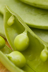 Image showing fresh peas on wooden background