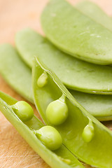 Image showing fresh peas on wooden background