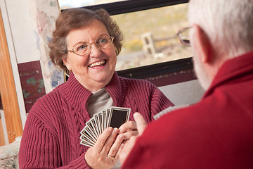 Image showing Happy Senior Adult Couple Playing Cards