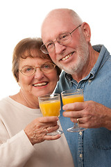 Image showing Happy Senior Couple with Glasses of Orange Juice