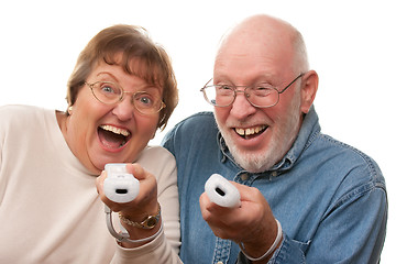 Image showing Happy Senior Couple Play Video Game with Remotes