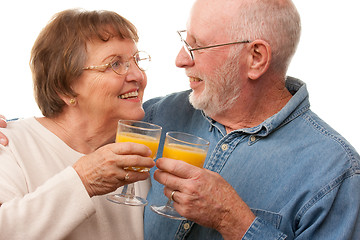 Image showing Happy Senior Couple with Glasses of Orange Juice