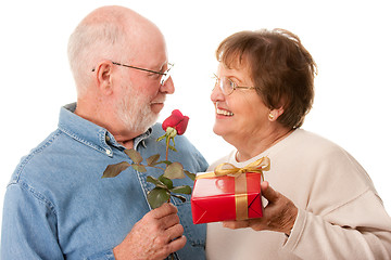 Image showing Happy Senior Couple with Gift and Red Rose