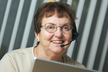 Image showing Smiling Senior Adult with Telephone Headset