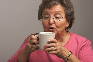Image showing Senior Woman Enjoys Her Coffee