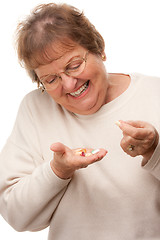 Image showing Attractive Senior Woman and Pills
