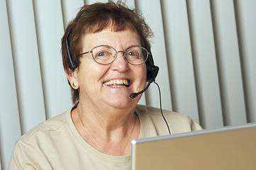 Image showing Smiling Senior Adult with Telephone Headset