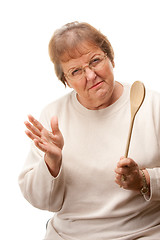 Image showing Upset Senior Woman with The Wooden Spoon