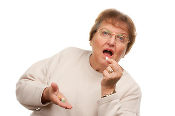 Image showing Attractive Senior Woman Taking Pills
