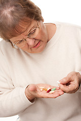 Image showing Attractive Senior Woman and Pills
