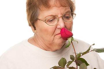 Image showing Attractive Senior Woman with Red Rose
