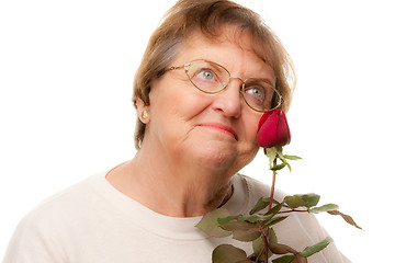 Image showing Attractive Senior Woman with Red Rose
