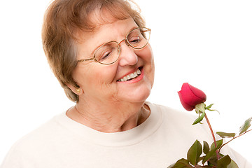 Image showing Attractive Senior Woman with Red Rose
