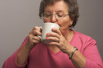 Image showing Senior Woman Enjoys Her Coffee