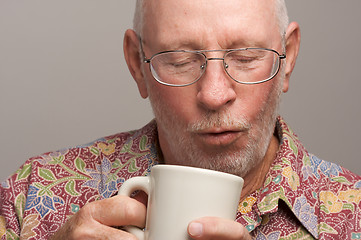 Image showing Senior Man Enjoys His Coffee