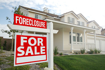 Image showing Foreclosure For Sale Real Estate Sign and House